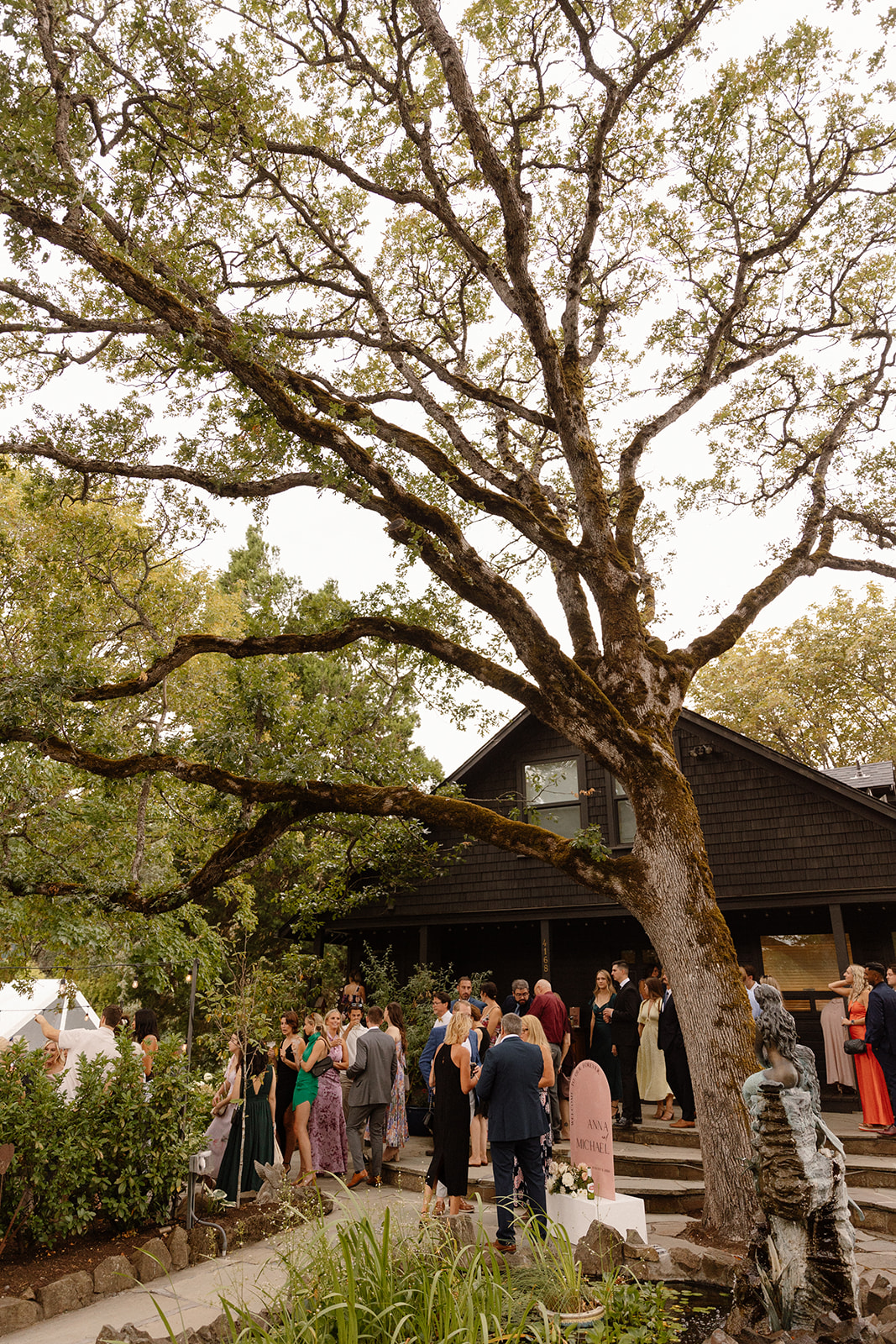 Guests enjoying cocktails on the patio of The Griffin House with picturesque views.