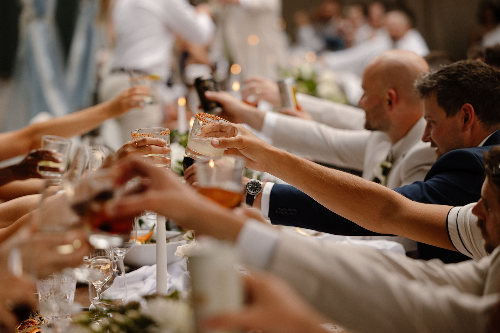 Guests cheering with cocktails during speeches at The Griffin House