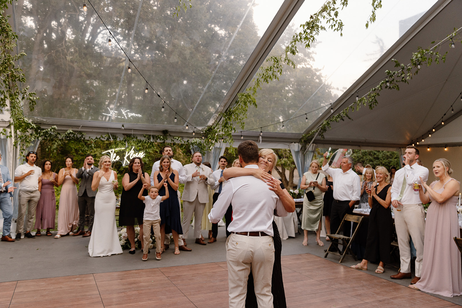 a heartfelt moment of a mother and son dancing during the reception at the griffin house