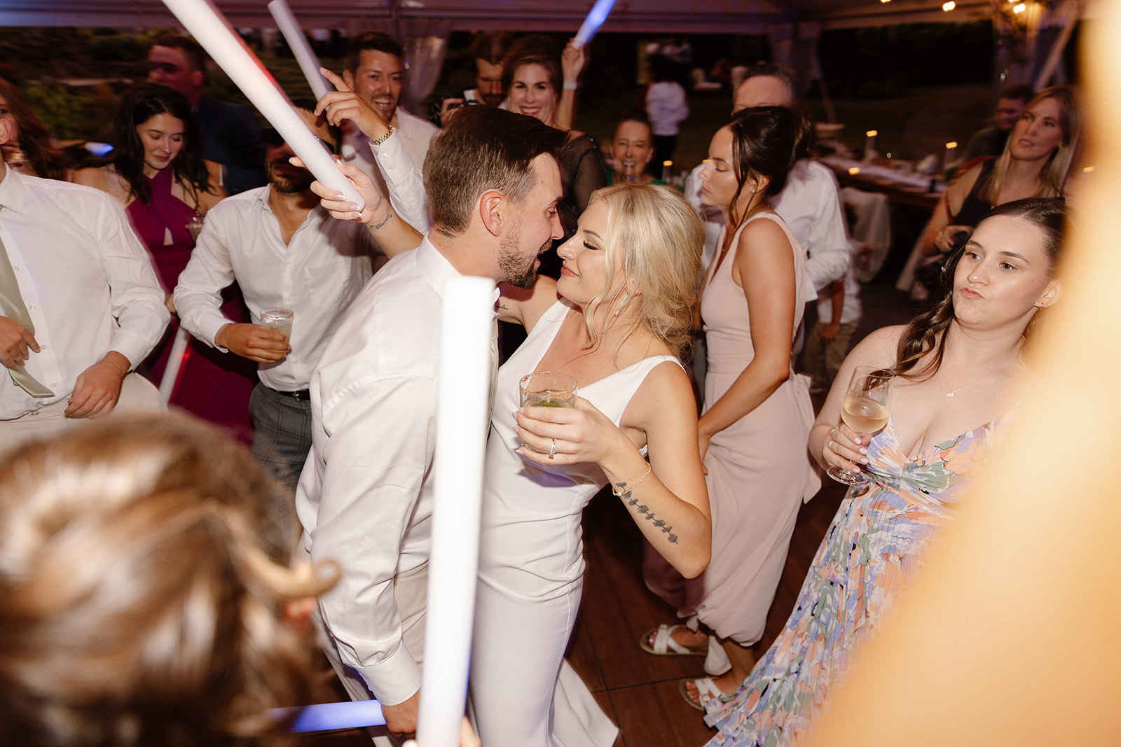 Bride and groom sharing a joyful dance on the dance floor at The Griffin House.
