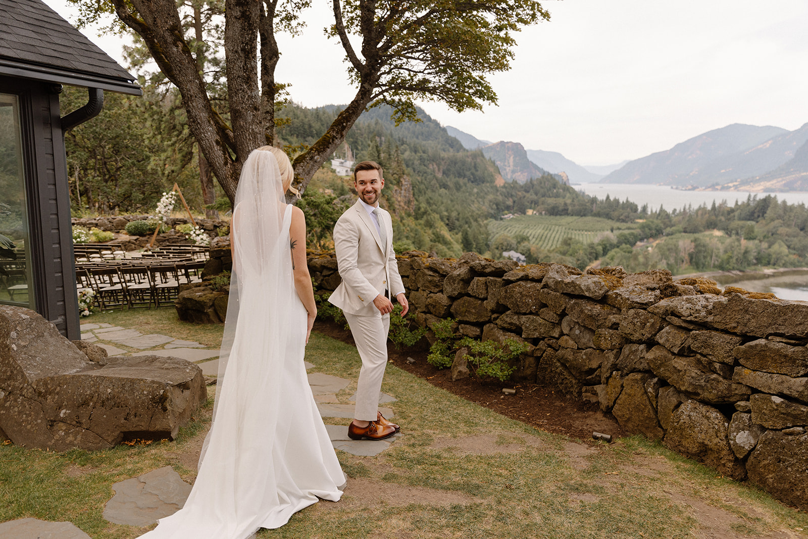 First look of the bride and groom with backdrop of the Columbia River Gorge