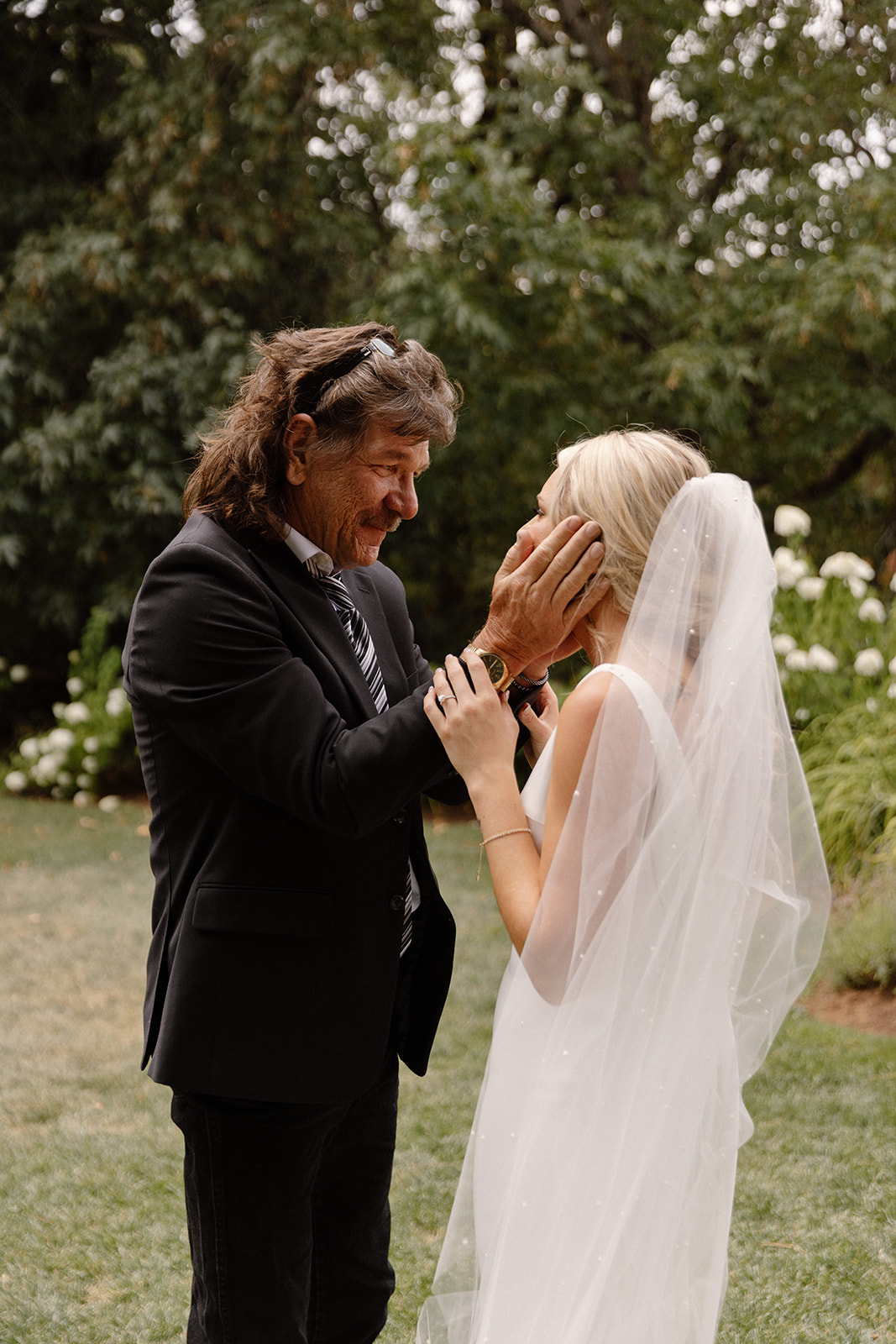 Bride having a special moment with dad on the lawn at the griffin house in hood river