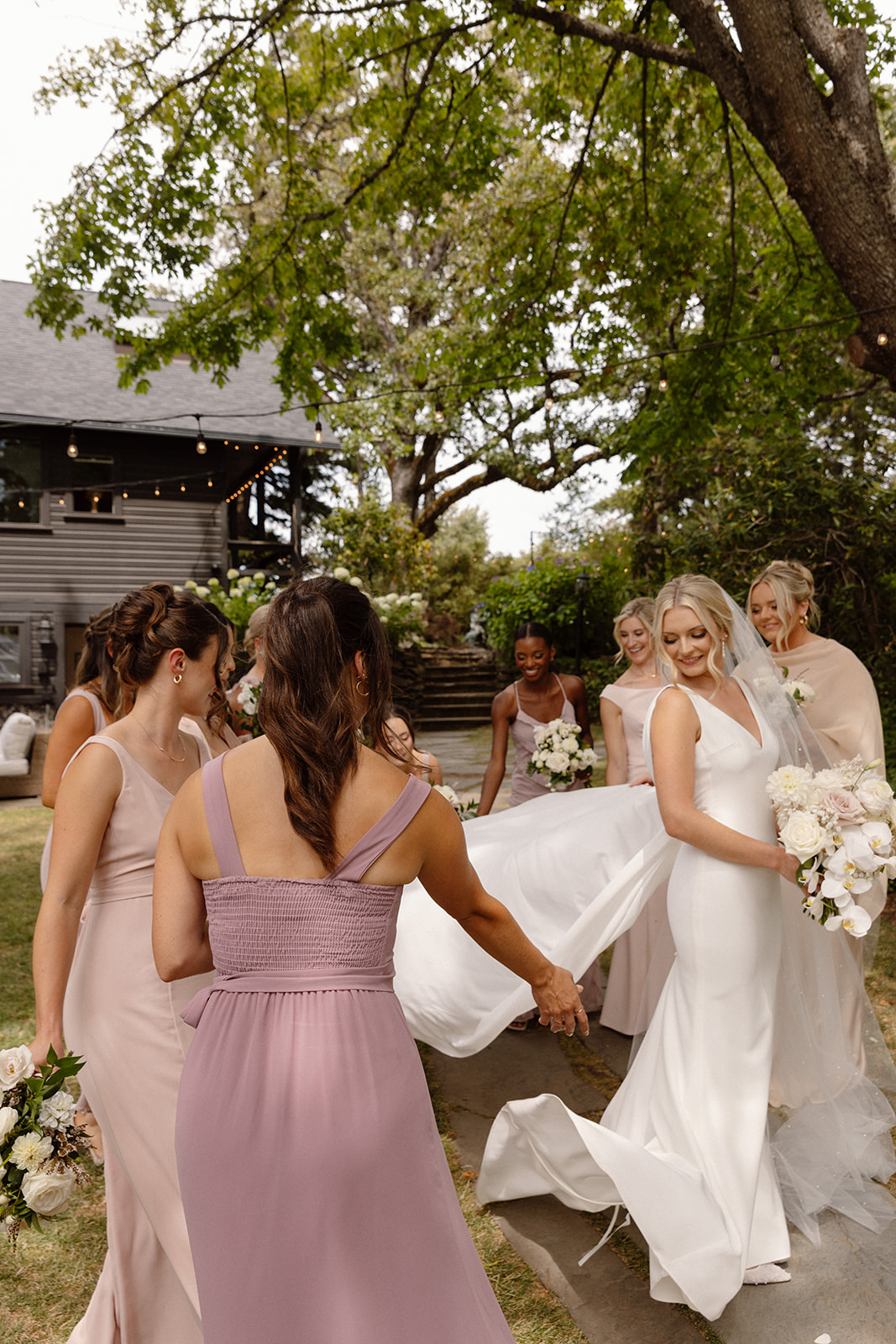 bridesmaids fluffing dress at the griffin house