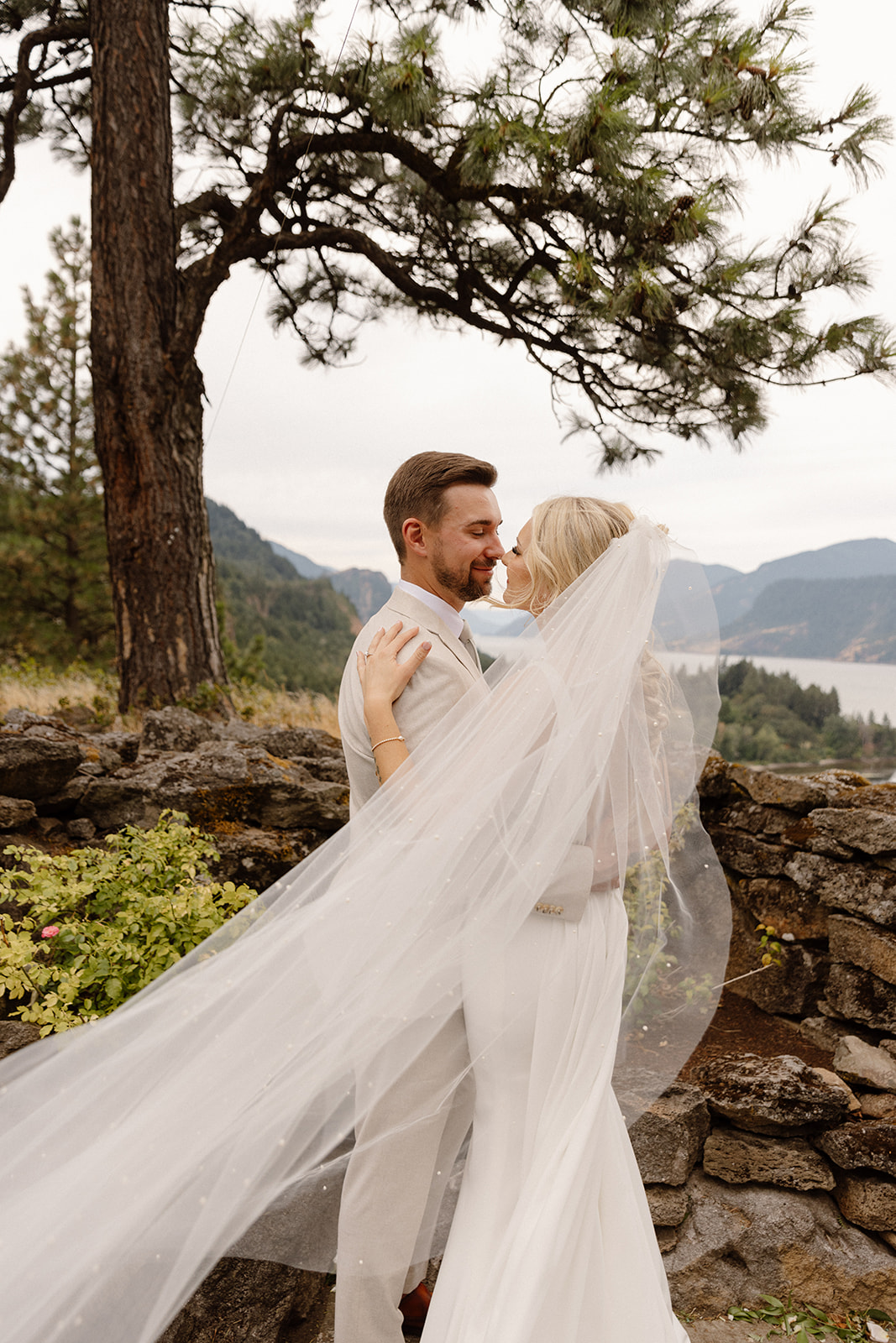 Bride and groom sharing a romantic moment on the terrace of The Griffin House.