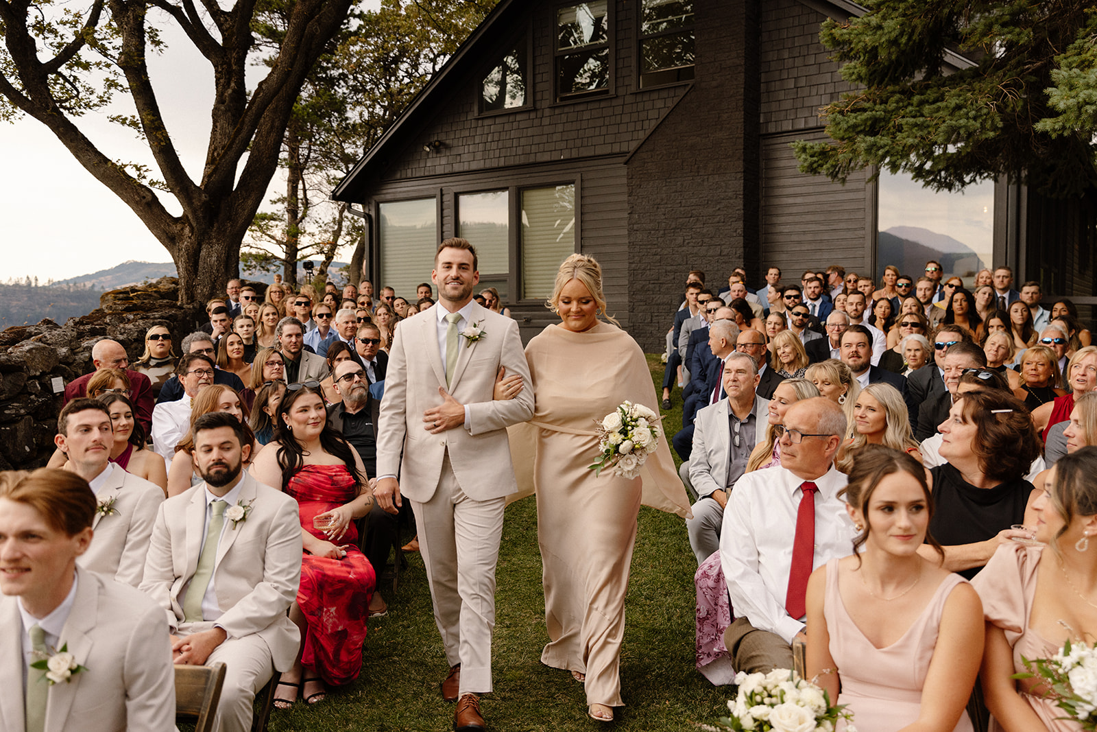 maid of honor and best man walking down the aisle