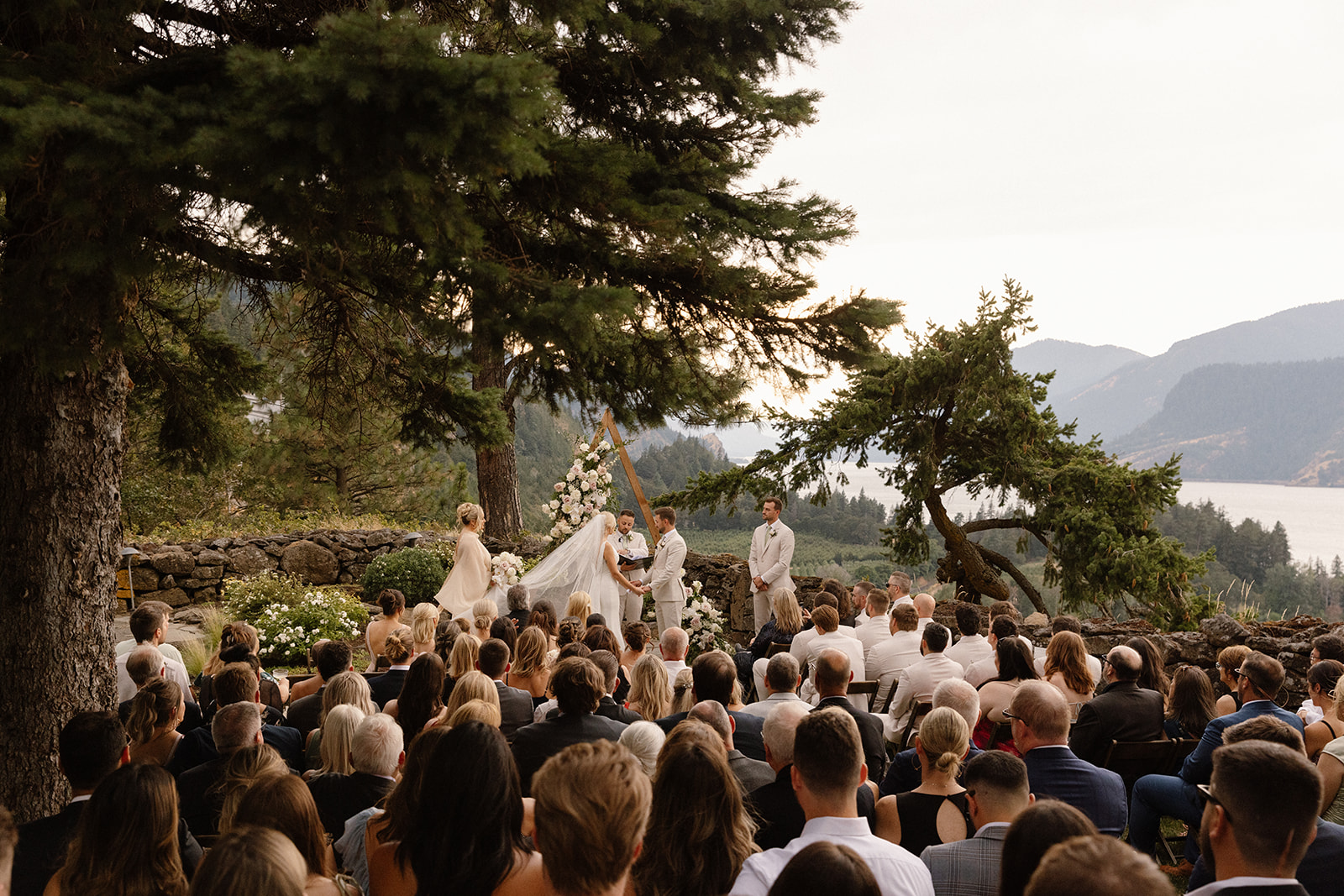 Guests enjoying the outdoor ceremony set against the backdrop of Hood River.