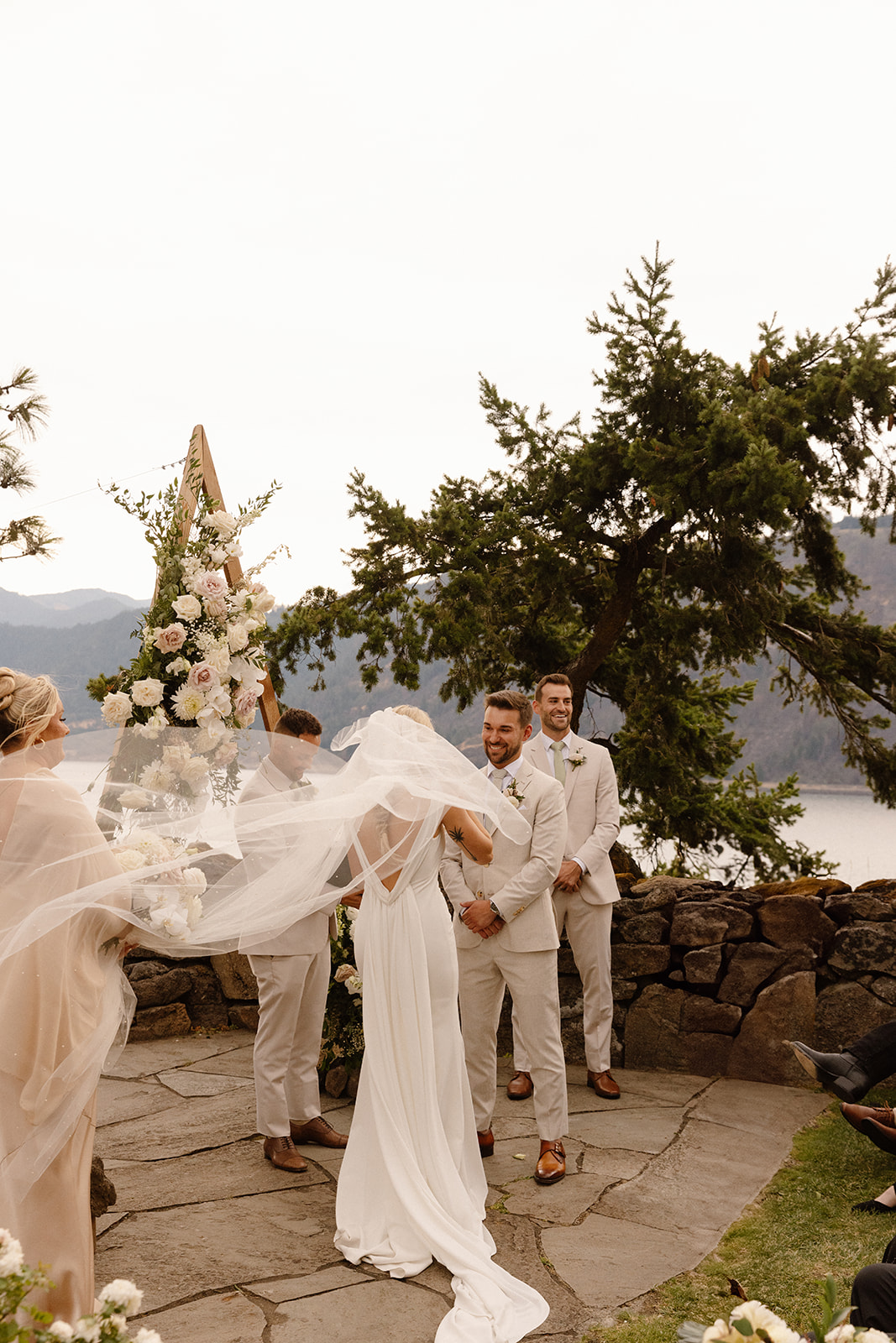 Brides veil blowing in the wind during the ceremony at The Griffin House.